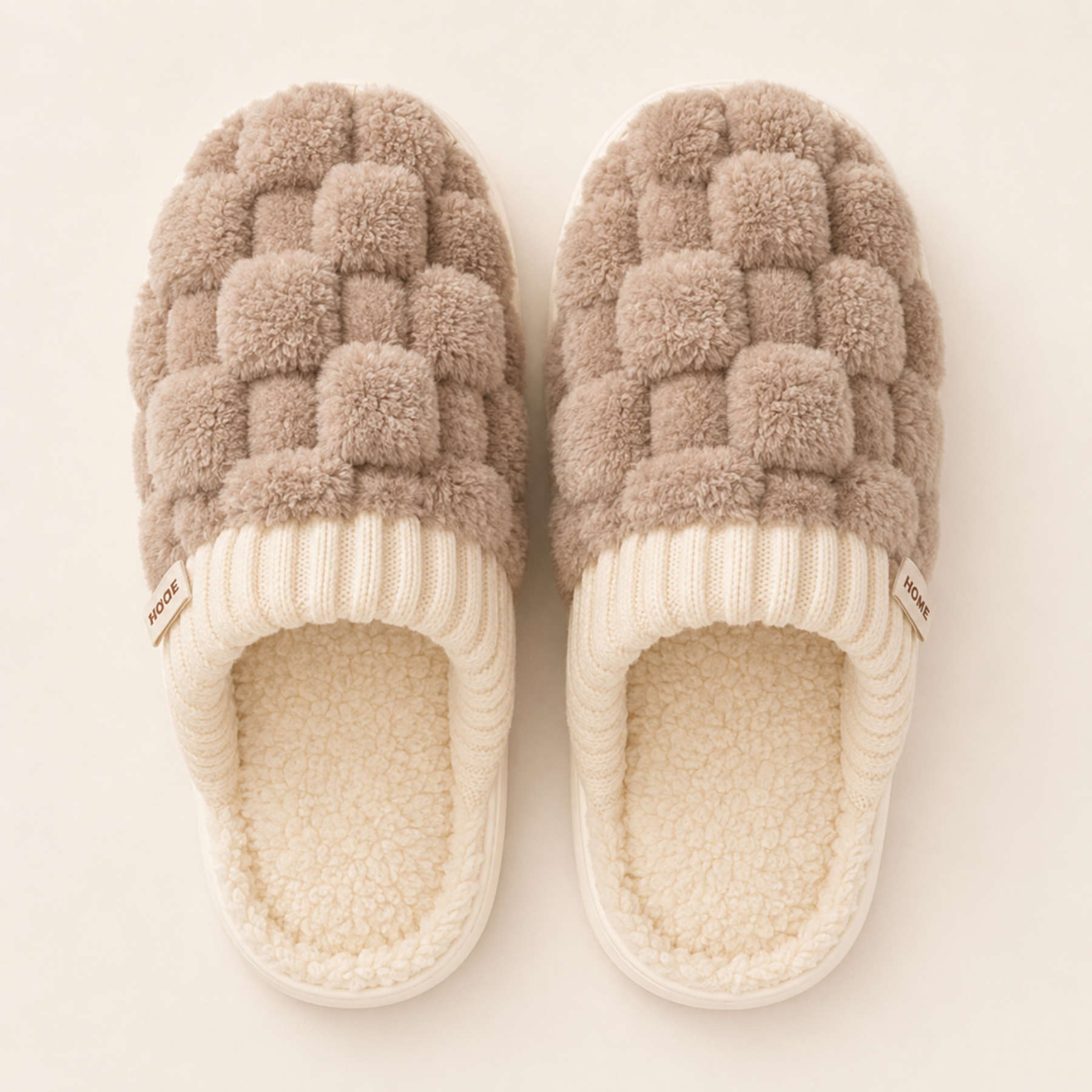 Overhead view of Warm Taupe Elowen slippers showing the woven-plush uppers and artificial-wool footbeds.