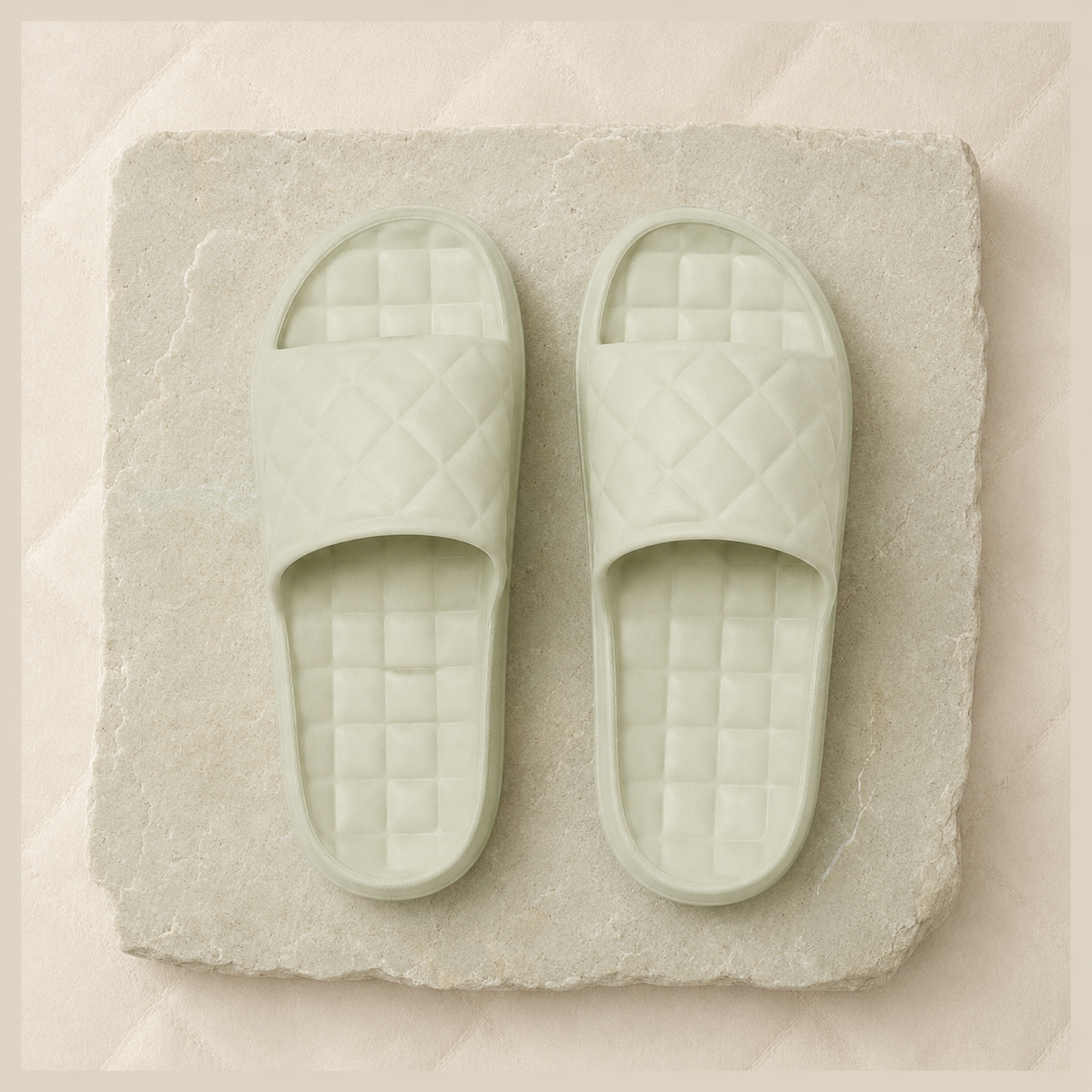 Top view of Sage Green Haven slides showing the diamond-quilted straps and checker footbeds.
