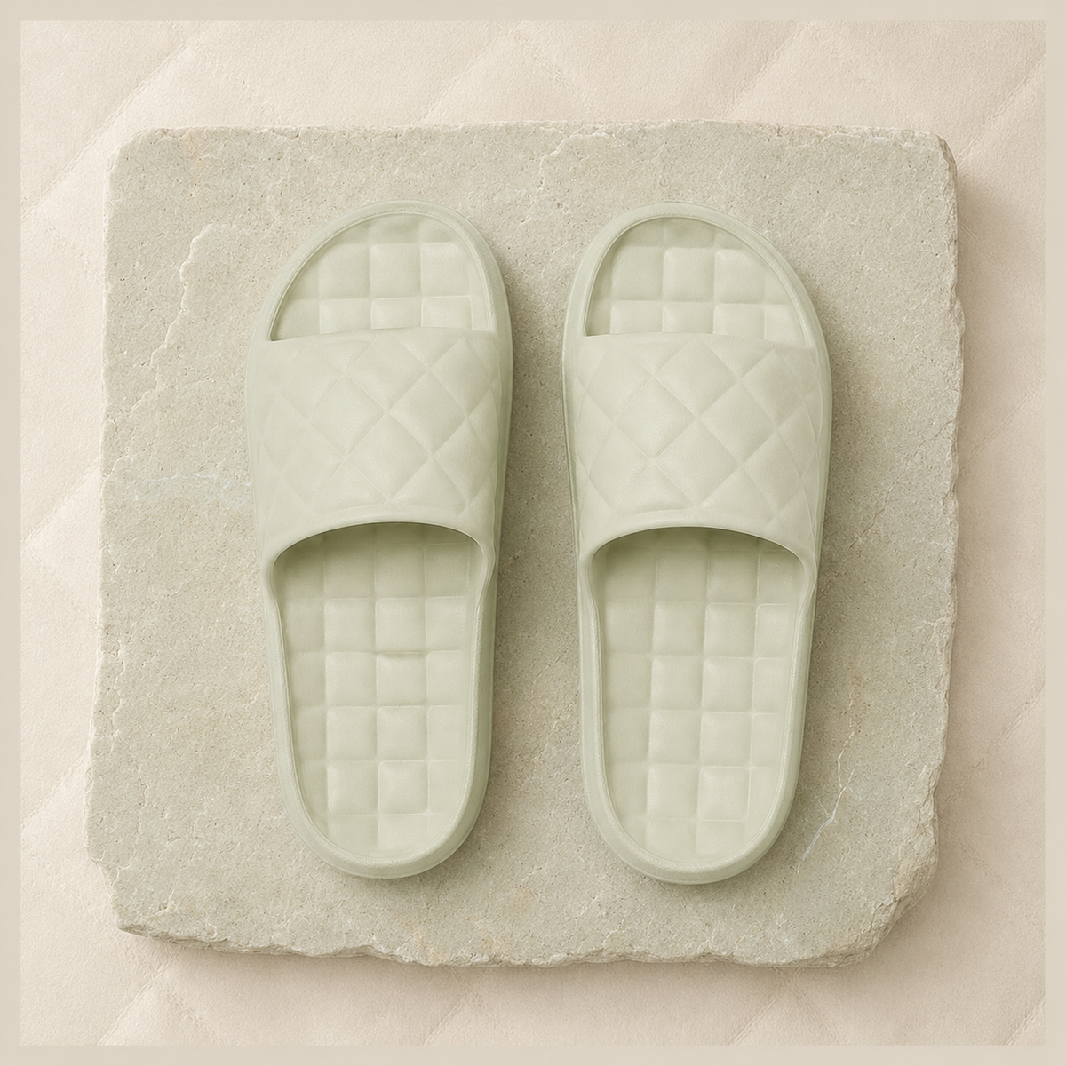 Top view of Sage Green Haven slides showing the diamond-quilted straps and checker footbeds.