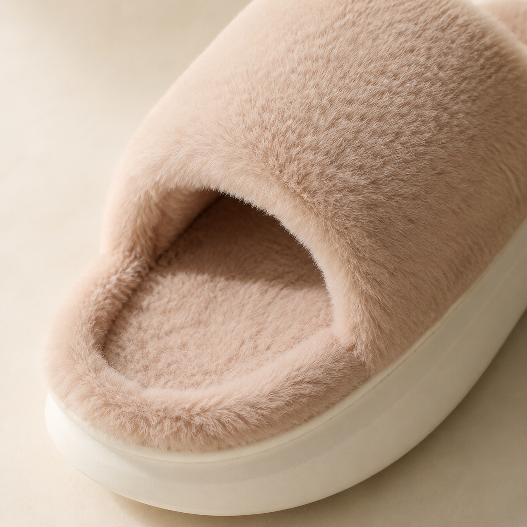 Close view of Veloura’s imitation-fur upper, faux-fur lining, velvety footbed and outsole edge.