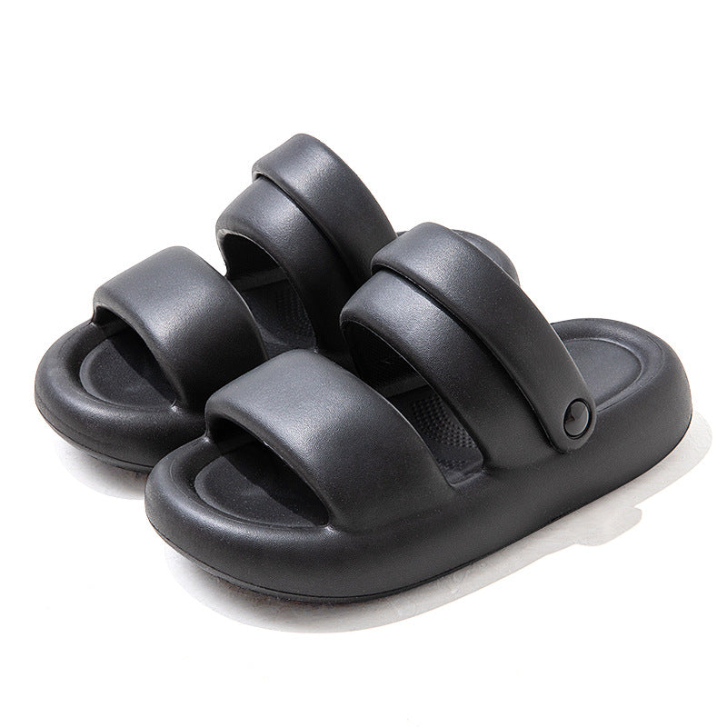 Cove sandals in Black, shown as a pair with two broad straps and rounded soles.